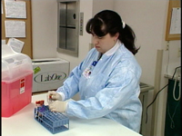 lab tech processing blood unsafely