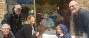 siblings gather outside an assisted living facility to visit their mom