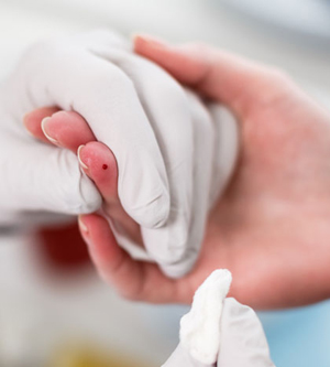 fingerstick blood being collected