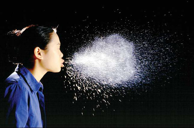 woman sneezing